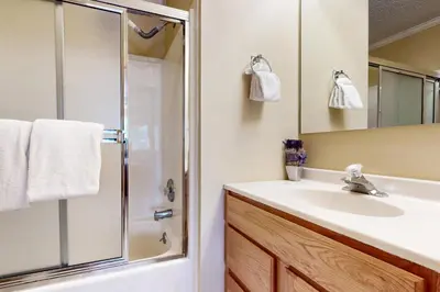 a bathroom with a sink and a shower at Saddle Ridge Townhome 402 in Silverthorne