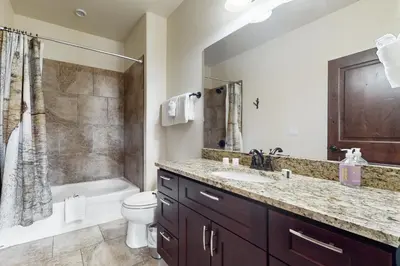 a bathroom with a sink and a toilet and a shower at Blue River Condo Unit 203 in Silverthorne