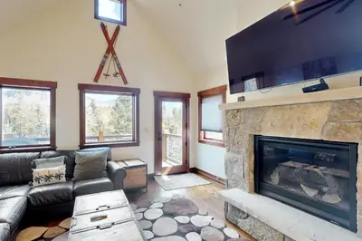 a living room with a fireplace and a couch at Blue River Condo Unit 203 in Silverthorne