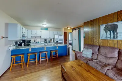 a living room with a couch and a kitchen at Mountian View Condo Unit S303 in Dillon