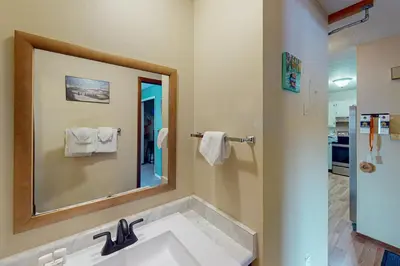 a bathroom with a sink and a large mirror at Mountian View Condo Unit S303 in Dillon