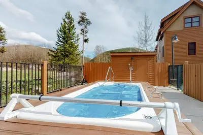 a swimming pool in the backyard of a house at Hop Inn At Antlers Gulch in Keystone