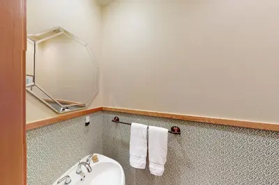 a bathroom with a sink and a mirror at Teller Townhomes 106 in Frisco