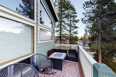 a balcony with two chairs and a bench on it at Teller Townhomes 106 in Frisco