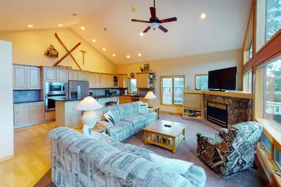 a living room with a couch and a fireplace at Teller Townhomes 106 in Frisco