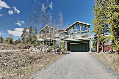 a large house with a garage on a road at Teller Townhomes 106 in Frisco