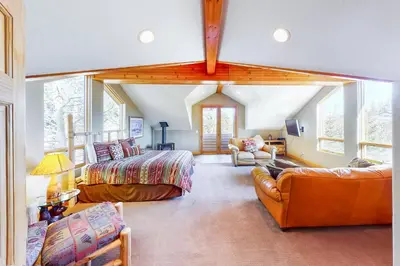a large living room with a bed and a couch at Western Wild Flower in Frisco