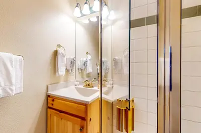 a bathroom with a sink and a shower at Northstar Townhome Unit 1968 in Keystone