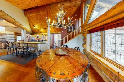 a dining room with a wooden table in a house at Fairy Tale House in Dillon