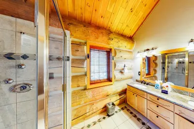 a bathroom with a shower and a sink at Fairy Tale House in Dillon