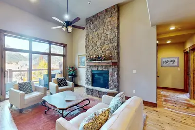 a living room with a couch and a fireplace at Bears Den Condo Unit 1 in Frisco