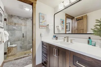 a bathroom with a sink and a shower at The Pines Condo Unit 2044 in Keystone