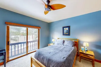 a bedroom with a bed and a ceiling fan at Water Dance Townhome 495 in Frisco