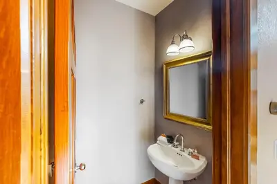 a bathroom with a sink and a mirror at Water Dance Townhome 495 in Frisco