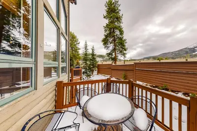 a balcony with a table and chairs on it at Water Dance Townhome 495 in Frisco