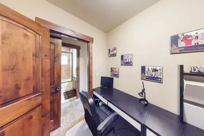 a home office with a desk and a door at Buffalo Lodge Townhomes 1293 in Silverthorne