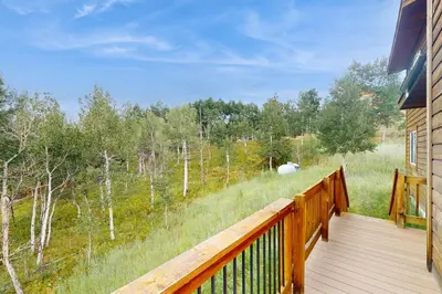 a wooden deck with a view of a field at Ski Your Heart Out in Silverthorne