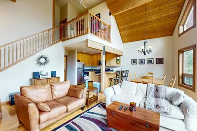 a living room with a couch and a table at Ski Your Heart Out in Silverthorne