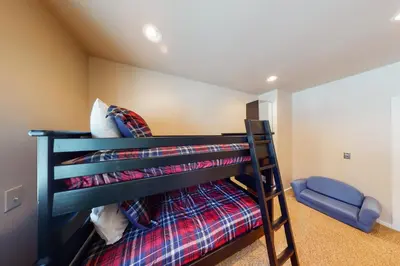 a bedroom with a bunk bed in a room at Wild Flower House in Frisco