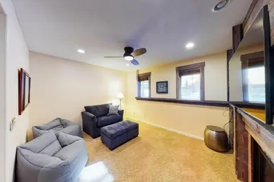 a living room with two chairs and a couch at Wild Flower House in Frisco