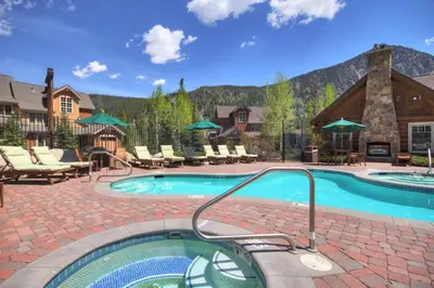 a swimming pool in a resort with a mountain at 6516 Settlers Creek condo in Snake River Health Services Incorporated Heliport