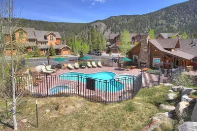 a house with a pool in a yard at 6516 Settlers Creek condo in Snake River Health Services Incorporated Heliport