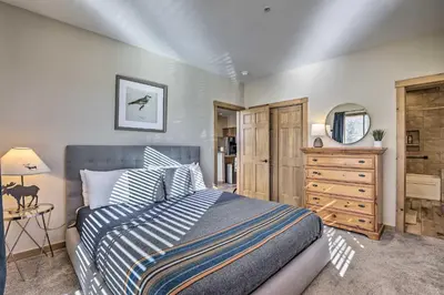 a bedroom with a bed and a dresser and a mirror at Frisco Condo with Balcony 7 Mi to Copper Mountain! in Frisco
