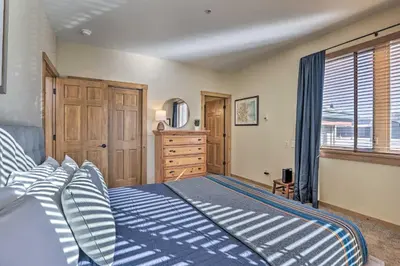 a bedroom with a bed and a dresser and a window at Frisco Condo with Balcony 7 Mi to Copper Mountain! in Frisco