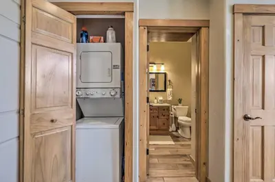 a small bathroom with a washer and dryer at Frisco Condo with Balcony 7 Mi to Copper Mountain! in Frisco