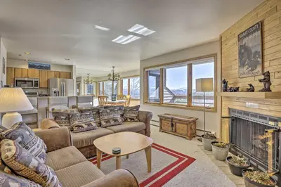 a living room with couches and a fireplace at Condo with Views and Hot Tub Access in Silverthorne! in Silverthorne