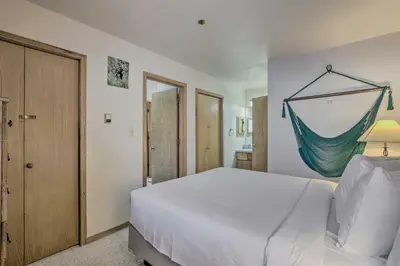 a bedroom with a bed with a hammock on the wall at Condo with Views and Hot Tub Access in Silverthorne! in Silverthorne