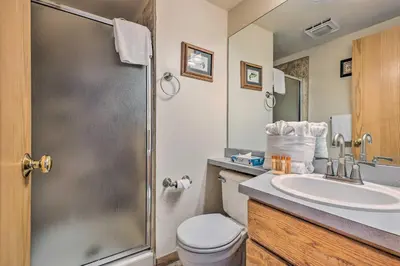 a bathroom with a toilet and a sink and a shower at Condo with Views and Hot Tub Access in Silverthorne! in Silverthorne