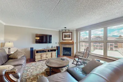 a living room with a couch and a table at The Towers Unit 407 in Frisco