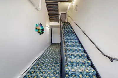 an escalator in a building with an empty staircase at Blue River Condo Unit 3301 in Silverthorne