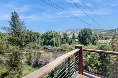 a balcony with a view of the mountains at Blue River Condo Unit 3301 in Silverthorne