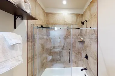 a shower with a glass door in a bathroom at New Keystone Resort Home in Keystone