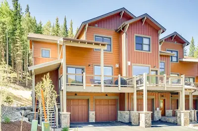 a large wooden house with a deck at New Keystone Resort Home in Keystone