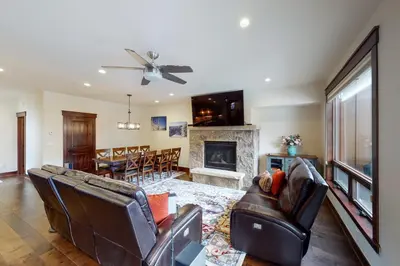 a living room with leather furniture and a fireplace at New Keystone Resort Home in Keystone