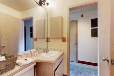 a bathroom with a sink and a mirror at Watch Hill Condos Unit 614 in Silverthorne