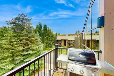 a grill on the balcony of a building at Marine Park Condo Unit C-16 in Frisco