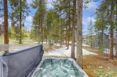 a hot tub in a tent in the woods at Mountain Modern Escape in Fraser