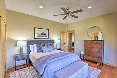 a bedroom with a bed and a ceiling fan at 6 Mi to Keystone Ski! Mtn-View Cabin with Game Room in Silverthorne
