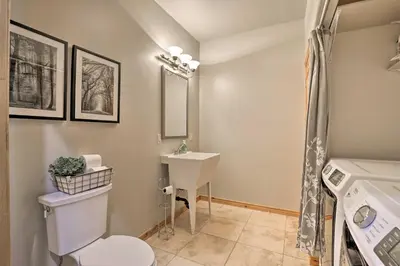 a bathroom with a toilet and a sink at 6 Mi to Keystone Ski! Mtn-View Cabin with Game Room in Silverthorne