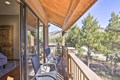 a porch with chairs and a view of the mountains at 6 Mi to Keystone Ski! Mtn-View Cabin with Game Room in Silverthorne