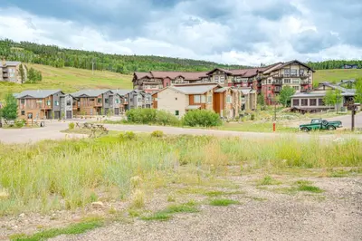 a group of houses on the side of a road at Steps to Conquest Ski Lift Granby Home with Grill in Granby