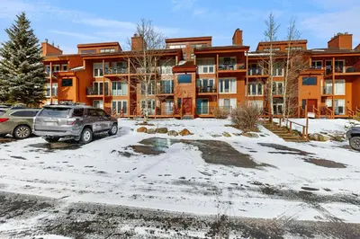 a parking lot in front of a large apartment building at Take the Mountain View in Silverthorne