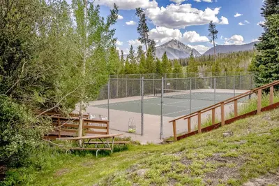 a tennis court in the middle of a field at Take the Mountain View in Silverthorne