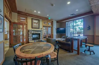a living room with a table and a couch at Buffalo Lodge 2 Bed 2 Ba BLCD2 in Keystone