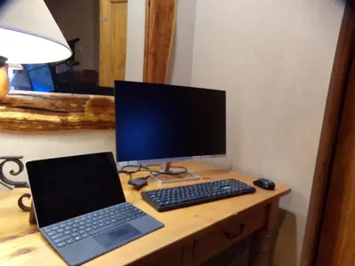 a desk with a computer monitor and a laptop on it at Buffalo Lodge 2 Bed 2 Ba BLCD2 in Keystone