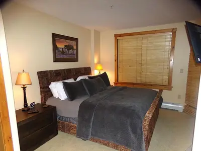 a bedroom with a large bed and a window at Buffalo Lodge 2 Bed 2 Ba BLCD2 in Keystone